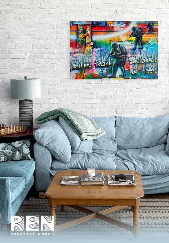 A thought-provoking abstract painting titled "Bullets Travel Distance & Time" by Adrian Reynolds hangs on a brightly coloured wall in a modern studio apartment.
